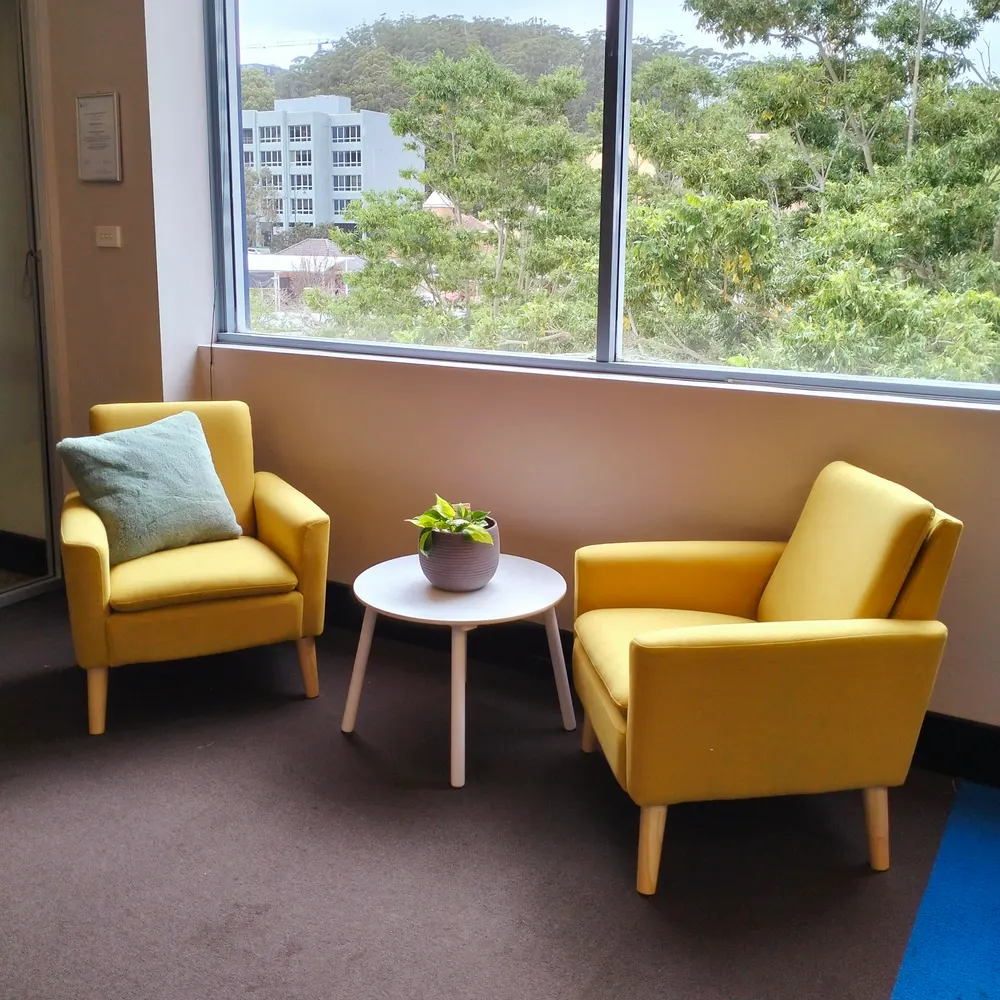 Sunny yellow armchairs by the window in the Speech Alive clinic in Gosford